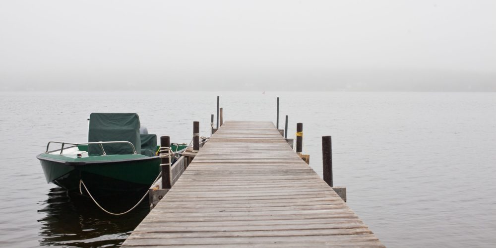 green boat at dock